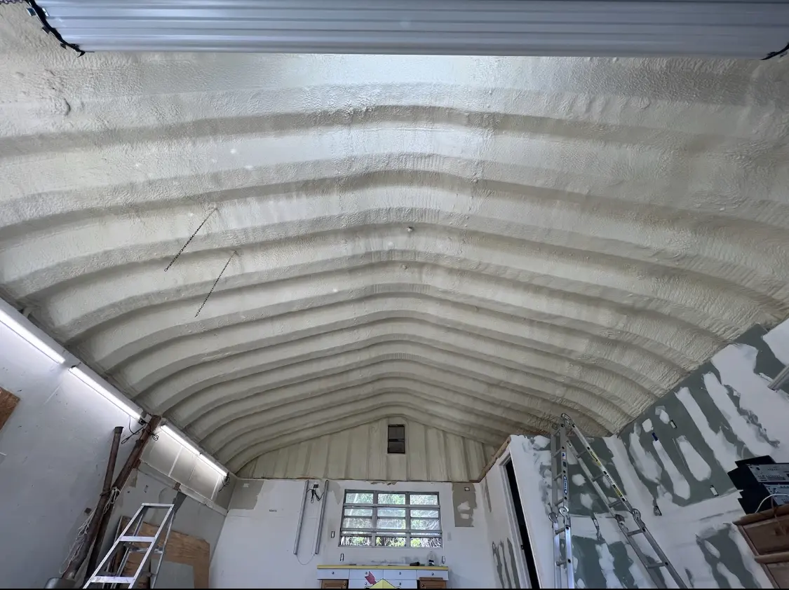 Spray polyurethane foam applied to the underside of a metal roof deck in Campbellsville
